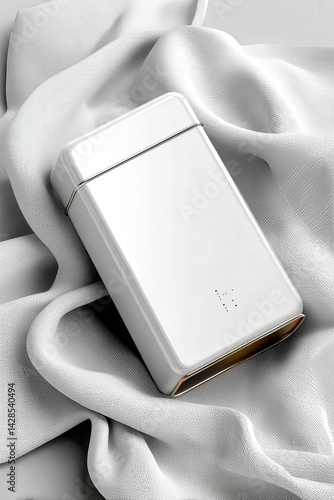 Obraz na płótnie Elegant White Portable Charger on Soft White Fabric Display w salonie