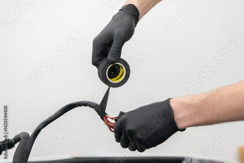 Wallpaper Mural Wiring Connections Being Insulated With Tape to Ensure Safety and Functionality in a Vehicle Repair Project Torontodigital.ca