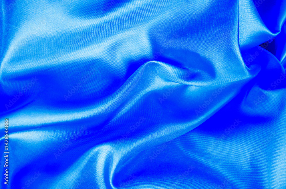 Obraz premium Light blue color silk in soft, smooth waves with a glossy finish. Suitable for design and wallpaper background