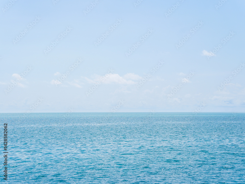 Fototapeta premium Aerial view clear blue sea, cloud sky background. Summer travel environment, the sea in Asia, during the holiday season, giving a natural relaxing feeling. Travel Thailand. Ocean waves water