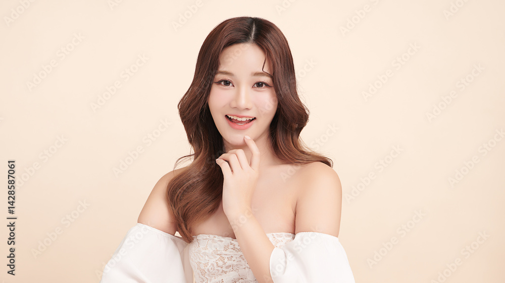 A beautiful young Asian woman with clean, fresh skin against a beige background. Skincare, facial treatment, cosmetology, beauty, and spa. An elegant portrait of an Asian woman. A beautiful young Asian woman with clean, fresh skin against a beige background. Skincare, facial treatment, cosmetology, beauty, and spa. An elegant portrait of an Asian woman.