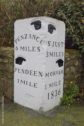 Ancient milestone, dated 1836, marking the distances to Penzance, St Just, Pendeen and Morvah, west Cornwall, England, UK.