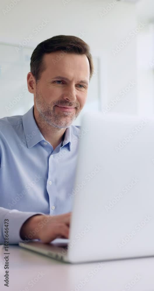 Vertical Video of businessman working at office opening laptop Vertical Video of businessman working at office opening laptop