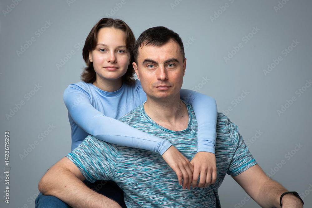 Studio portrait of family: father and daughter