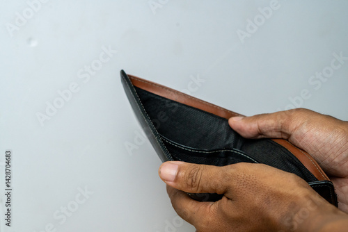 Empty wallet reveals financial hardship