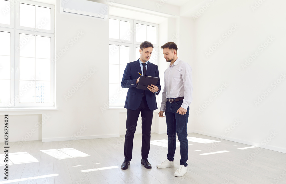 Realtor agent, client or architect, interior designer showing new empty apartment plan to man at meeting, consulting customers making real estate offer, mortgage loan investment and construction idea