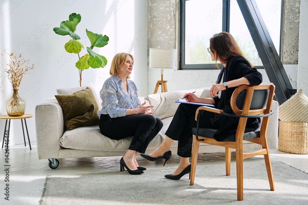 Mental therapy session, middle aged woman patient talking to professional psychologist