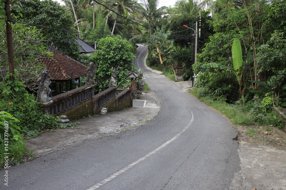 Road with a bridge and a house in the background Road with a bridge and a house in the background