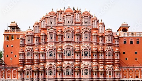 vibrant jaipurrs hawa mahal with intricate pink sandstone facade on white background