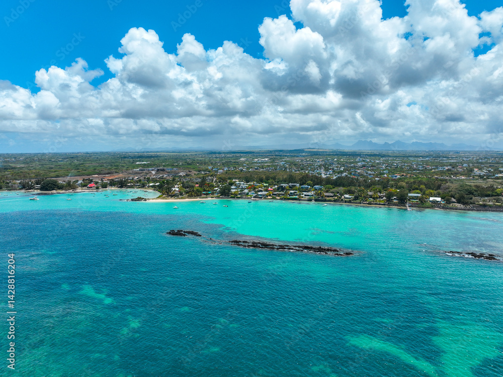 Fototapeta premium Aerial panorama of Grand Baie coastline with homes, beach, and turquoise waters
