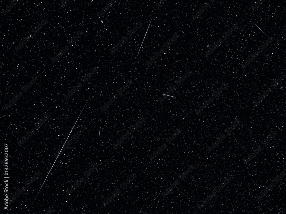Lyrid meteor shower streaks across a star-filled night sky.