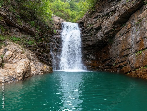 Cliffside waterfall with a hidden cave behind it, reachable only by a challenging hiking trail