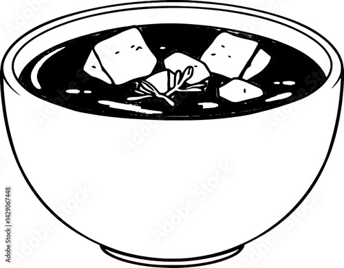 Bowl of Creamy Tomato Soup with Cheese Cubes and Herbs