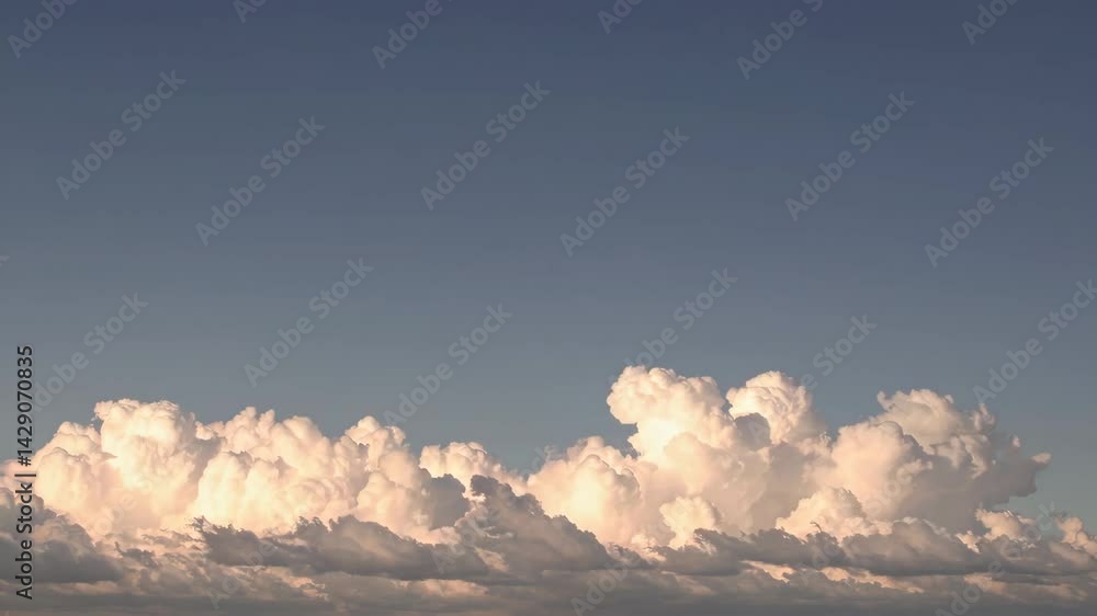 Timelapse of white clouds against a clear blue sky
