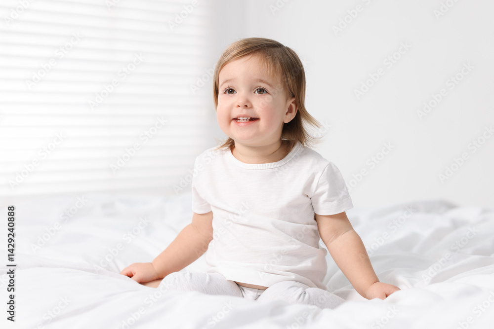 Cute little baby girl on bed at home Cute little baby girl on bed at home