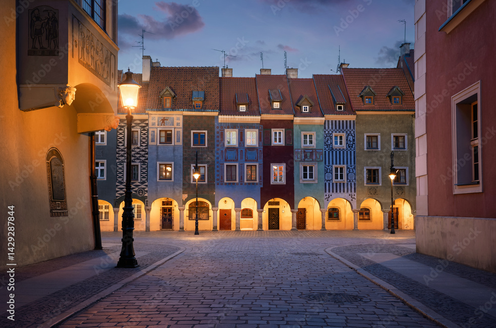 Fototapeta premium Colorful, fairy tale, historic townhouses at dusk in old town Poznan, Poland