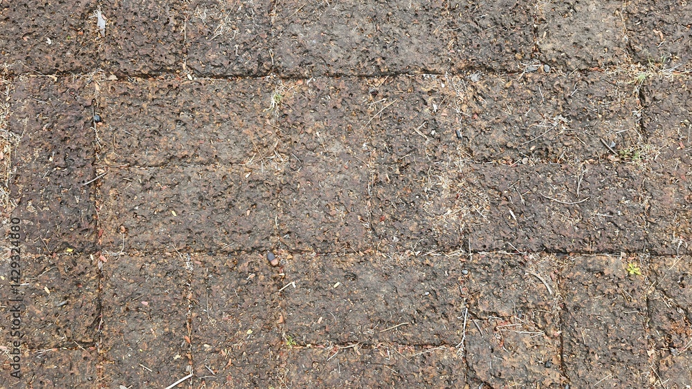 A dirt path paved with large stones, the stone courtyard of an ancient castle in Thailand, the floor of a castle in the past. Texture Image. A dirt path paved with large stones, the stone courtyard of an ancient castle in Thailand, the floor of a castle in the past. Texture Image.