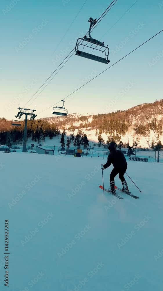 Young Man Skiing Down Snowy Slope — Winter Sports and Mountain Adventure Young Man Skiing Down Snowy Slope — Winter Sports and Mountain Adventure