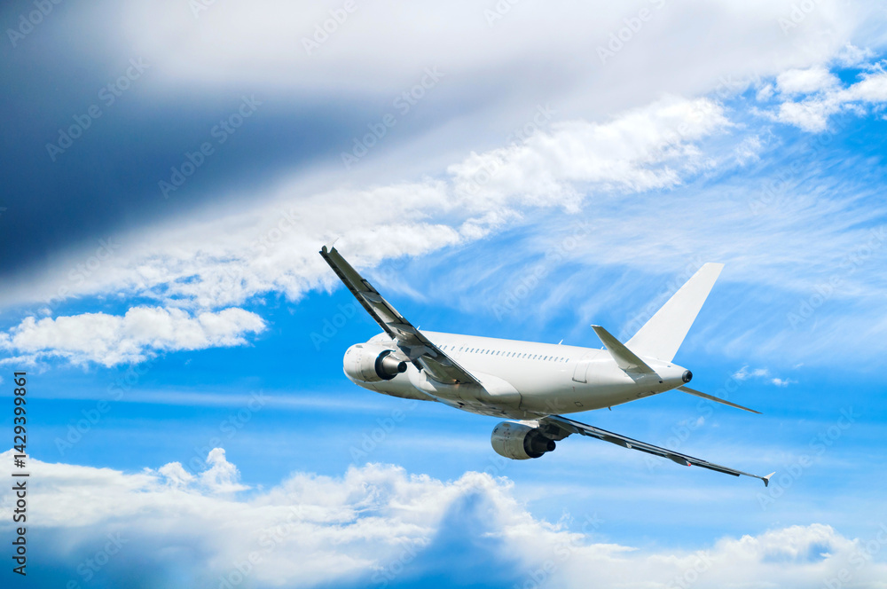 Obraz premium Airplane flying in the sky - travel background with white commercial airplane in flight, travel by air concept