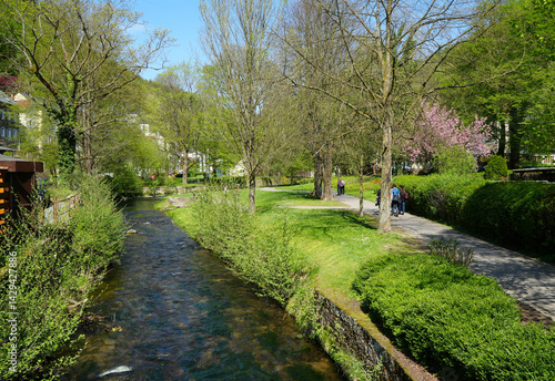 Obraz na płótnie Bad Schandau, Germany, Spa park and pedestrians and tourists Kirnitzsch river w salonie
