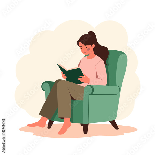 Woman enjoying reading a book while relaxing on a green chair  