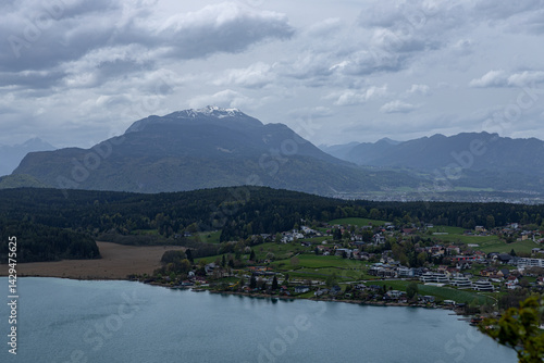 фотографія View of the Austrian lake Faaker See from above against the background of the sn