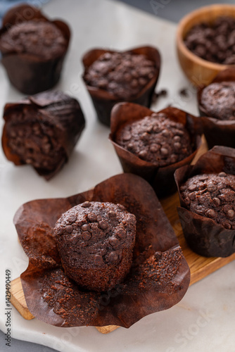 Wallpaper Mural Chocolate chip muffins on a board served with milk with one muffin unwrapped Torontodigital.ca