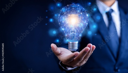 Obraz na płótnie A man in a suit holding a light bulb shaped like a network in his hand against a dark background w salonie