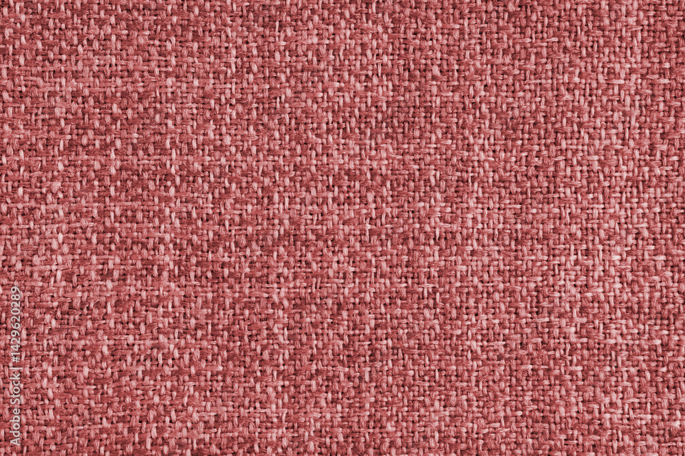 Fototapeta premium Upholstery red colored jacquard fabric coarse weave texture. Textile background, furniture textile material, wallpaper, backdrop. Cloth structure close up, macro