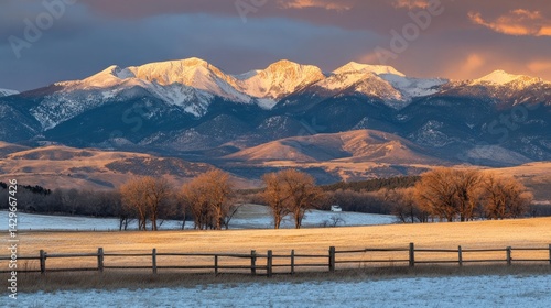 Sunset over snowy mountains, warm light hitting icy peaks with dramatic sky contrast