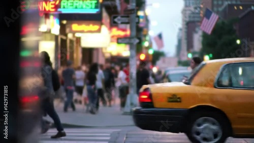 Busy city street with people walking, taxis passing, and neon signs glowing at dusk