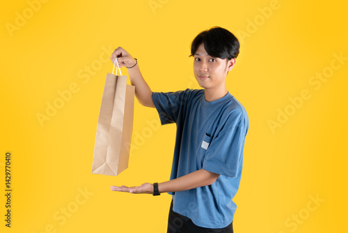 a man showing his brown shopping bag