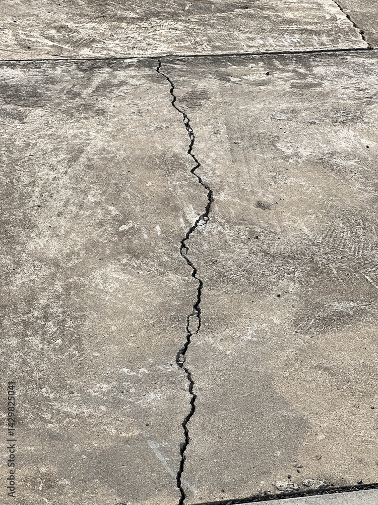 Fototapeta premium broken cement road texture