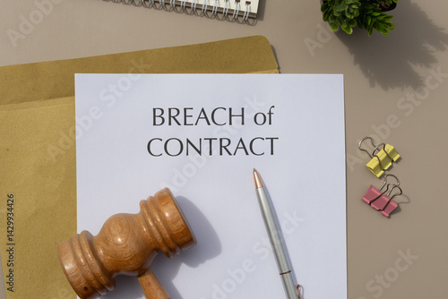Legal Dispute Setup: Breach of Contract Document with Gavel and Pen