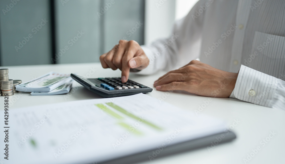 Fototapeta premium Businessman checking bills taxes bank account balance and calculating annual financial statements of company. Accounting Audit Concept