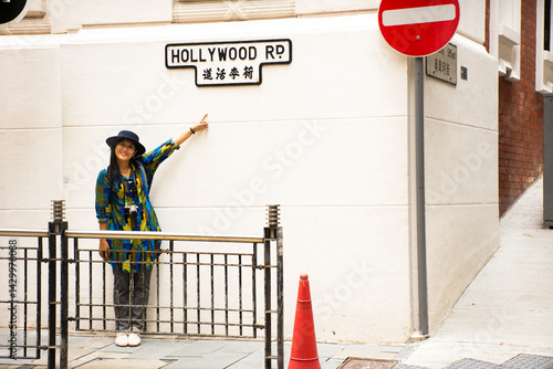 Wall Mural Travelers thai woman travel visit and posing for take photo with view of Hollywo