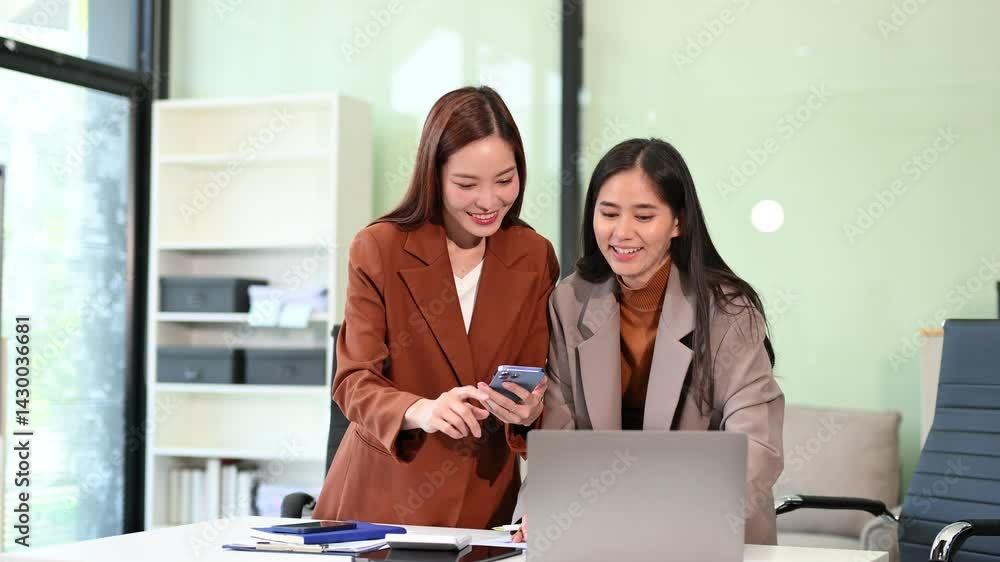 Business team of two executives working together using laptop in office. Business team of two executives working together using laptop in office.