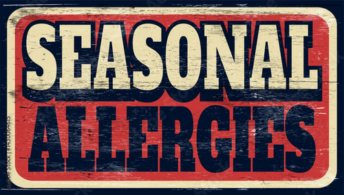 Aged and worn seasonal allergies sign on wood