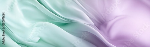 Gentle sweeps of pale mint green and soft lilac create a serene and calming abstract flowing fabric backdrop