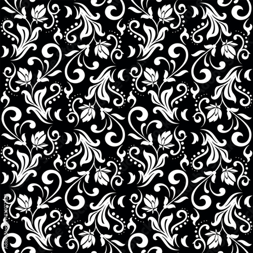 Wallpaper in the style of Baroque. White and black floral ornament. Seamless vector background. Graphic pattern for fabric, wallpaper, packaging. Ornate Damask flower illustration.