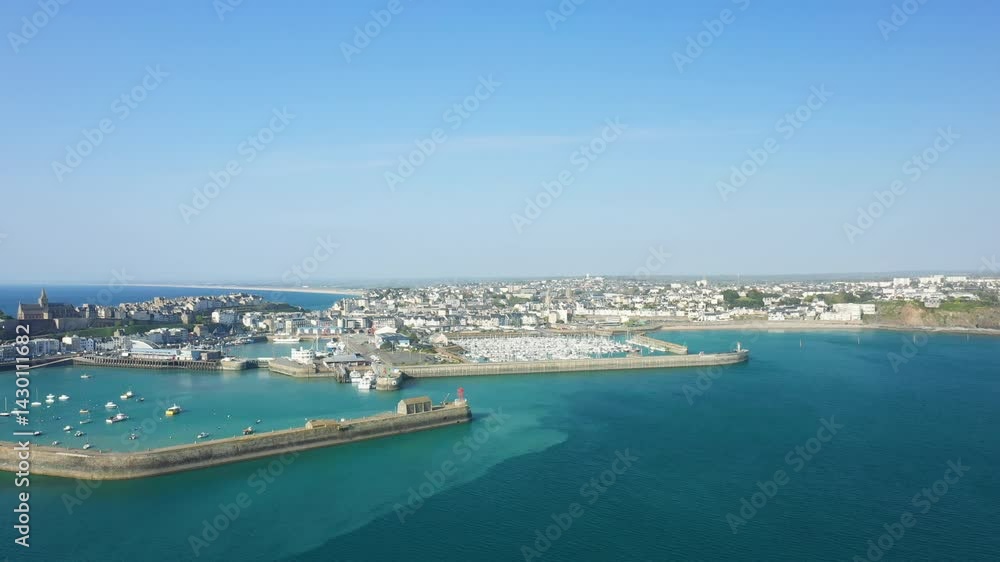 Granville between the upper town and the port in Europe, in France, in Normandy, in the English Channel, in spring, on a sunny day. Granville between the upper town and the port in Europe, in France, in Normandy, in the English Channel, in spring, on a sunny day.
