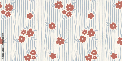 Seamless pattern with ink doodle abstract flowers and leaves on vertical stripes. Trendy aesthetic blue and brown background. Hand drawn vector illustration. Boho, beach, jungle wallpaper.