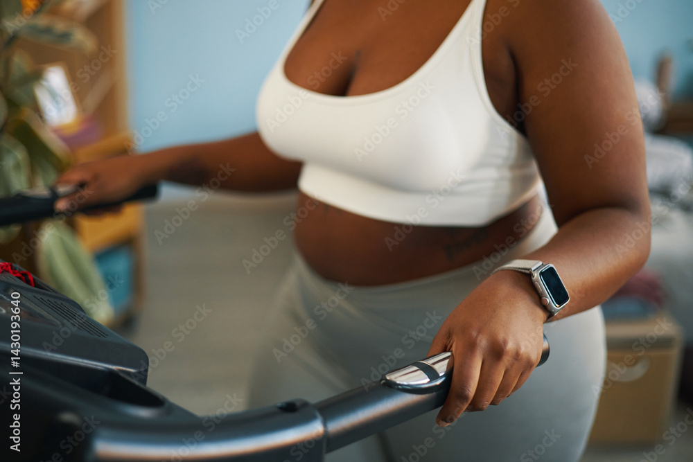 Person using treadmill wearing smartwatch and fitness gear in indoor setting emphasizing contemporary workout routine and healthy lifestyle Person using treadmill wearing smartwatch and fitness gear in indoor setting emphasizing contemporary workout routine and healthy lifestyle