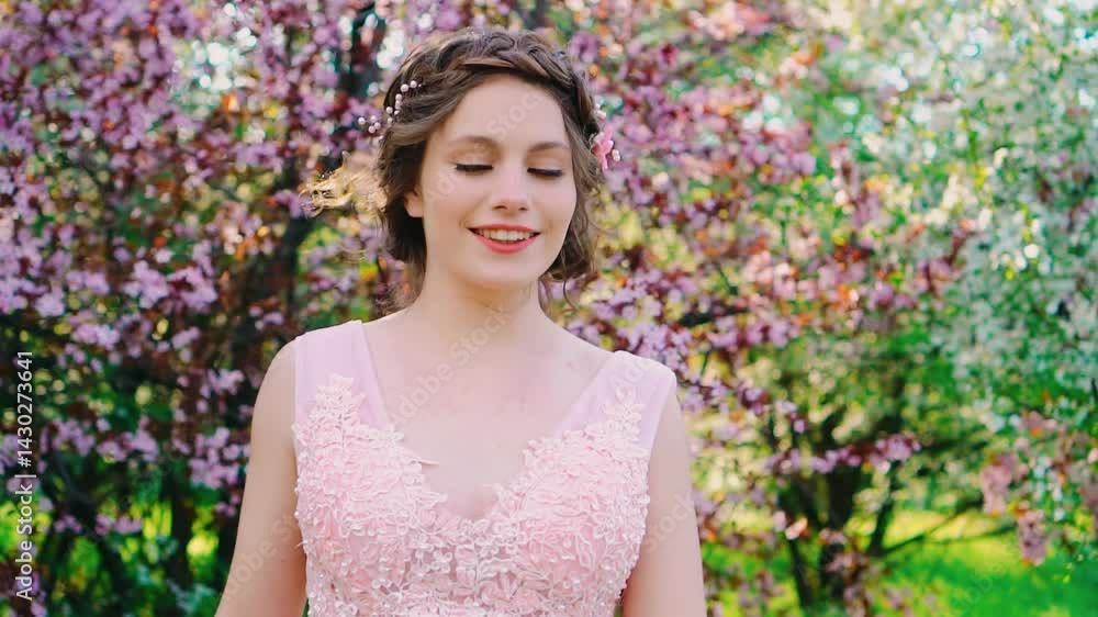 Cute happy adult girl smiling face eyes lips walking in spring blooming garden health concept freedom from allergies. Background park green trees, white pink flowers. Woman is joyful cheerful portrait Cute happy adult girl smiling face eyes lips walking in spring blooming garden health concept freedom from allergies. Background park green trees, white pink flowers. Woman is joyful cheerful portrait