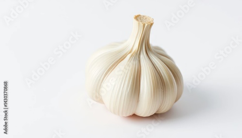 Single head of garlic, close-up, light background