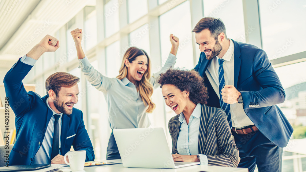 A group of people are celebrating a victory in a business meeting