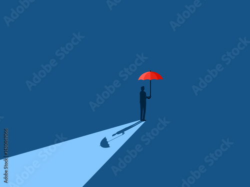 Businessman protecting himself with a red umbrella