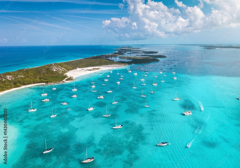 Aerial view of the numerous moored sailboats and yachts at the coast of Stocking Island, The Exumas, Bahamas