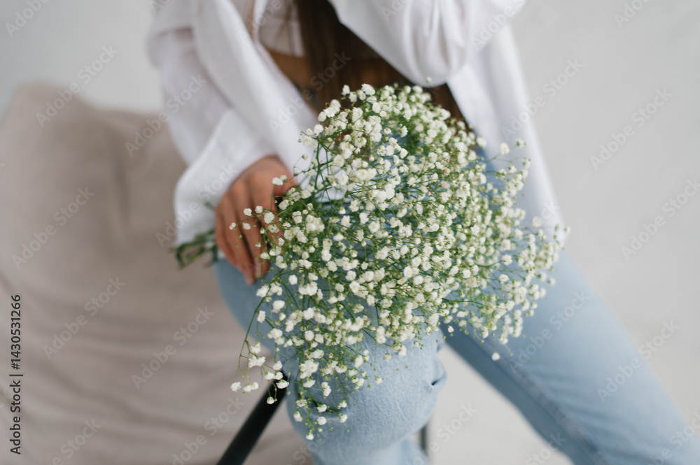Woman Holding White Gypsophila Flowers