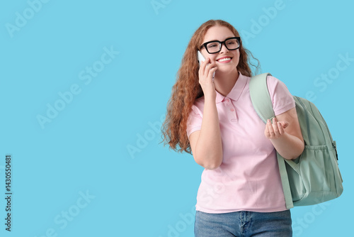 Happy female student with b...
